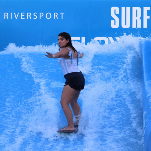 Team member surfing at Riversport OKC.